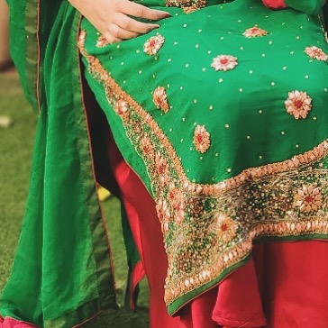 Image of a green shirt and maroon plazo embroidered dress, perfect for weddings and bridesmaids, showcasing intricate detailing and elegant design.