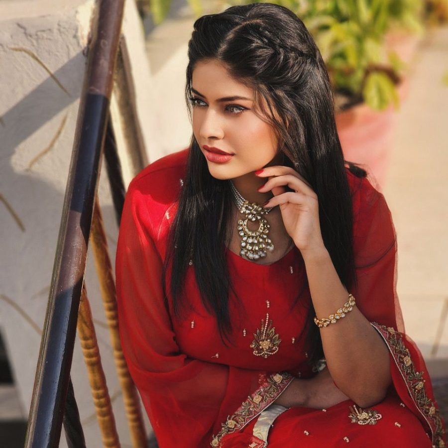 Red shirt and flapper dress with intricate embroidery, perfect for bridesmaids.